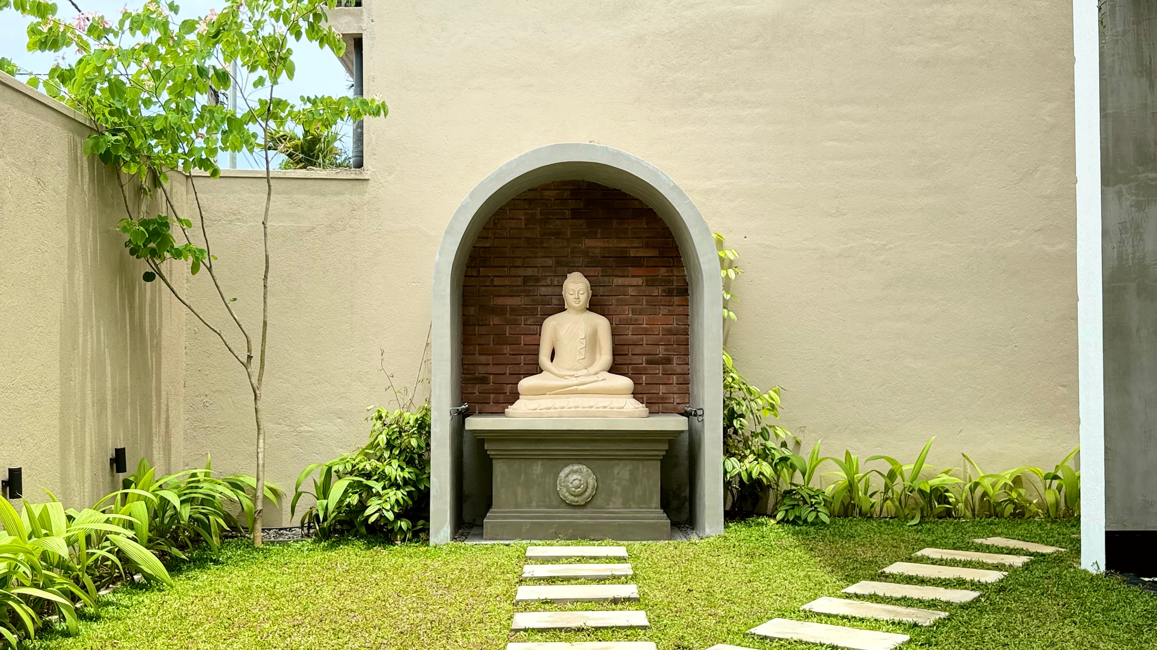 Garden Buddha alcove in the grounds of Ayu by TARA